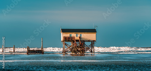 Pile dwelling on the beach of Sankt Peter-Ording in Germany.