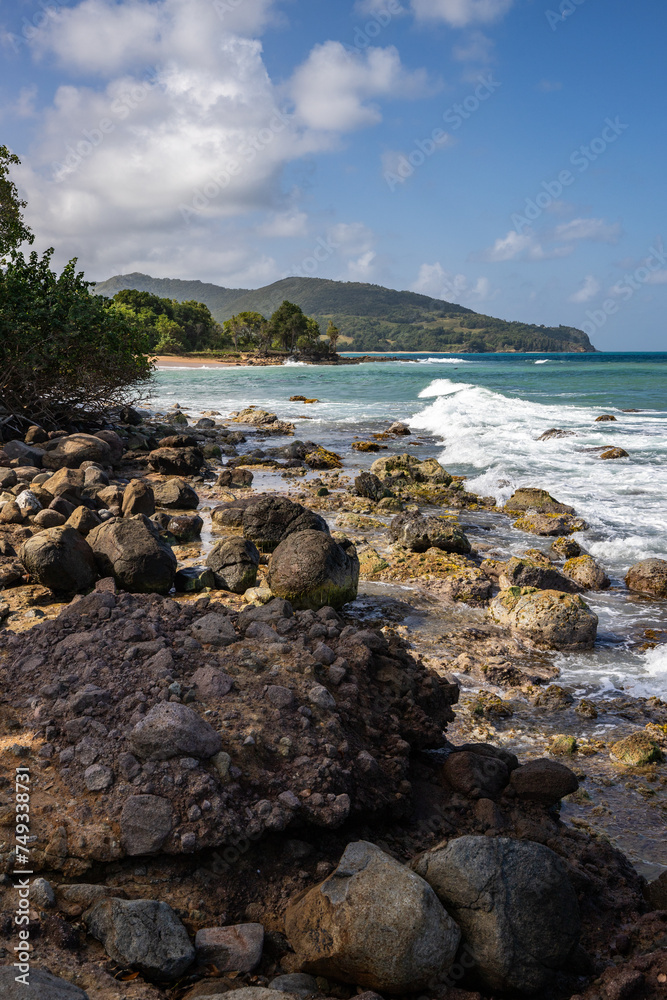 Nature in a special landscape. A rocky coast by the sea. Great landscape shot of cliffs in the Caribbean, the waves breaking against the island of Guadeloupe in the French Antilles.