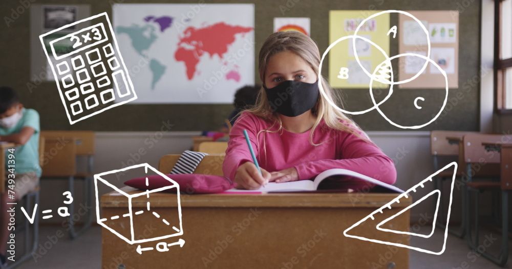 Fototapeta premium Image of school items icons moving over schoolchildren wearing face masks