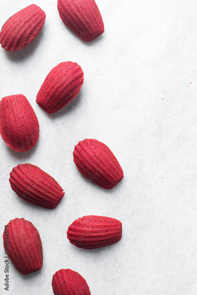 Top view of Red velvet madeleines on a marble tray, red madeleines cake or cookies for bakery Top view of Red velvet madeleines on a marble tray, red madeleines cake or cookies for bakery