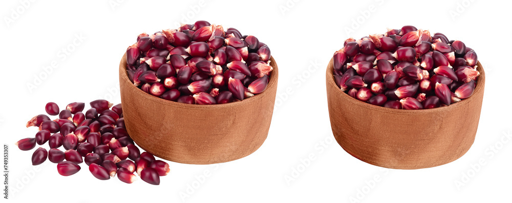 Purple corn seeds in wooden bowl isolated on white background with full depth of field Purple corn seeds in wooden bowl isolated on white background with full depth of field
