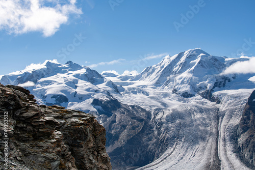 View summer 2021 of Dufourspitze  or Monte Rosa  and Lyskamm in Monte Rosa massif  Pennine Alps  on border of Switzerland and Italy near Zermatt with between peaks the Grenzgletscher  border glacier 