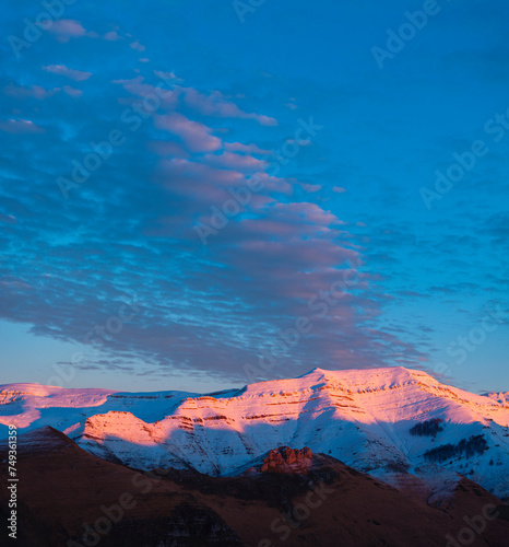 Last lights of the peaks of the Miera Valley in winter, aerial view of the Miera River Valley. Landscape in winter. Valleys Pasiegos. Cantabria. Spain. Europe photo