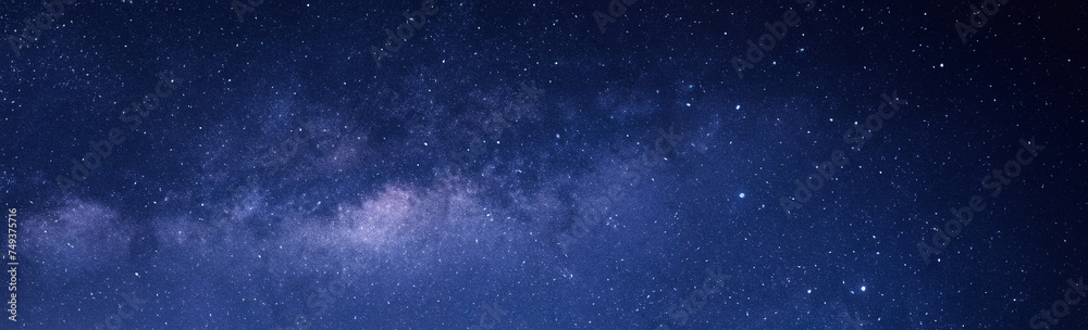 Blue Night Sky, Milky Way and Stars on Dark Background with Noise and Grain, Captured through Long Exposure and Selective White Balance