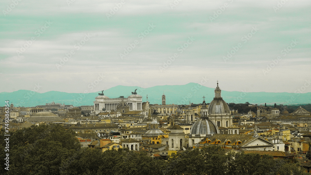 Panoramic view of several streets of Rome on a sunny day with fluffy clouds in the background, Italy