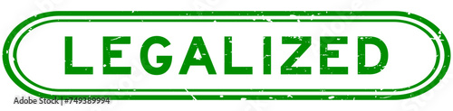 Grunge green legalized word rubber seal stamp on white background
