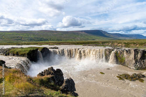 Panoramic view from the Eastern bank of the Godafoss waterfall in Iceland which runs through the Bardardalur valley