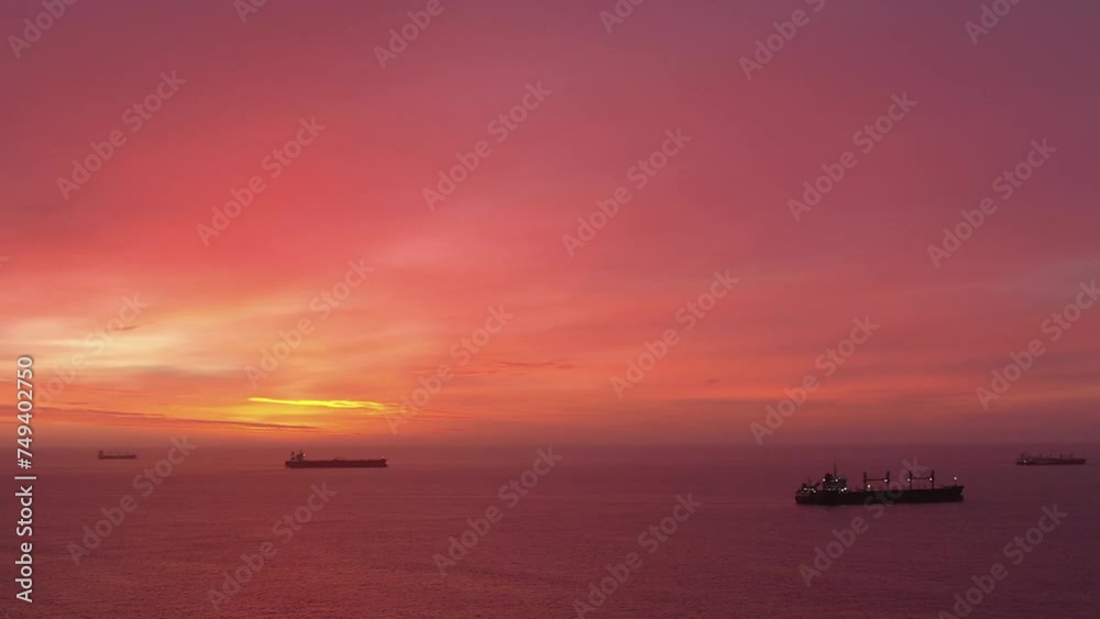Vessels on raid. Red fiery sunset. Aerial view Vessels on raid. Red fiery sunset. Aerial view