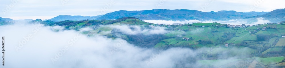 Obraz premium Aerial drone view of the winter landscape around the town of Gainza and Amezqueta and the Txindoki Mountain. Aralar Mountain Range. Goierri region. Gipuzkoa. Basque Country. Spain. Europe