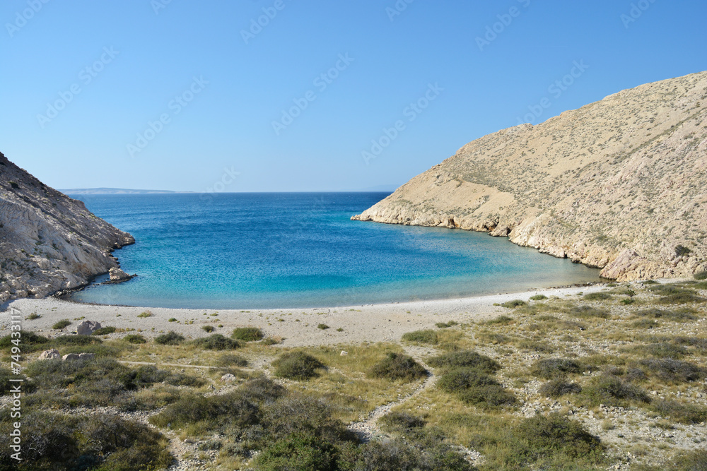 Gravel beach in the Vela Draga bay on the island Krk, Croatia
