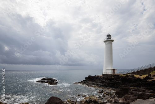 Le Phare du Vieux-Fort  white lighthouse on a cliff. Dramatic clouds overlooking the sea. Pure Caribbean on Guadeloupe  French Antilles  France