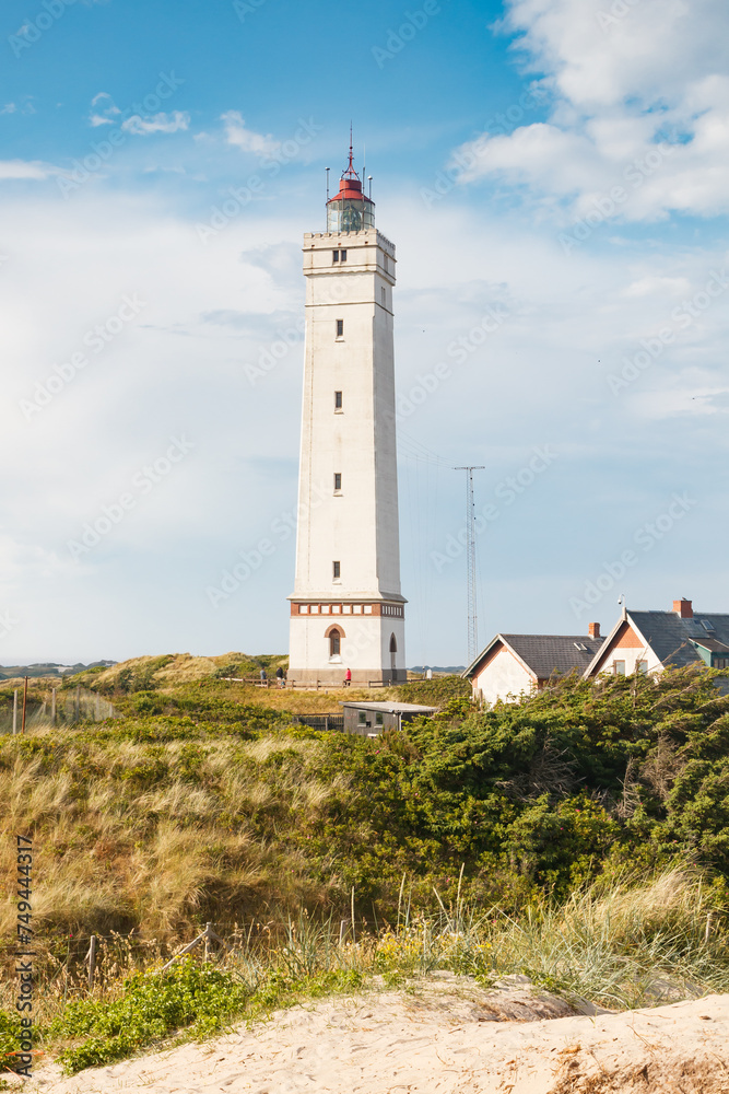 Lighthouse in the sand dunes on the beach of Blavand, Jutland Denmark Europe