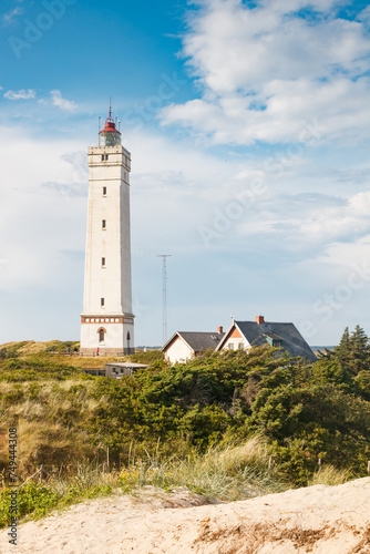 Lighthouse in the sand dunes on the beach of Blavand, Jutland Denmark Europe