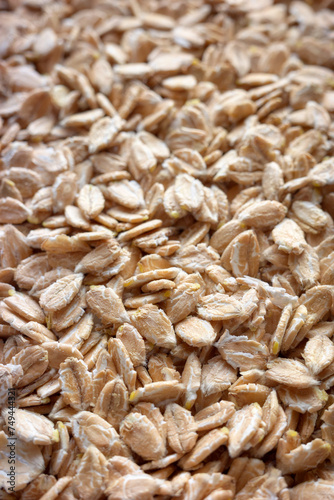 Close up photo of spelt flakes, selective focus, food background.