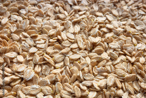 Close up photo of spelt flakes, selective focus, food background.