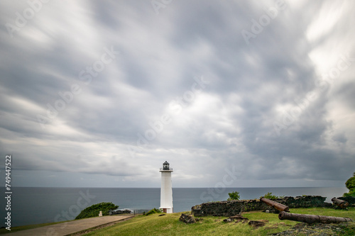 Le Phare du Vieux-Fort  white lighthouse on a cliff. Dramatic clouds overlooking the sea. Pure Caribbean on Guadeloupe  French Antilles  France