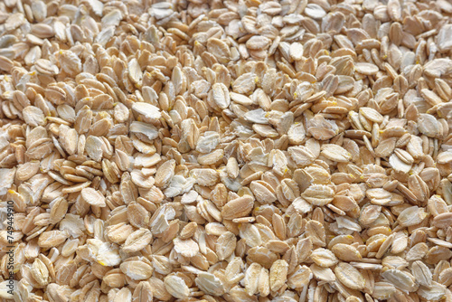 Close up photo of rye flakes, selective focus, food background.