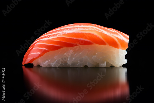 Nigiri sushi with rice and salmon fish on black background
