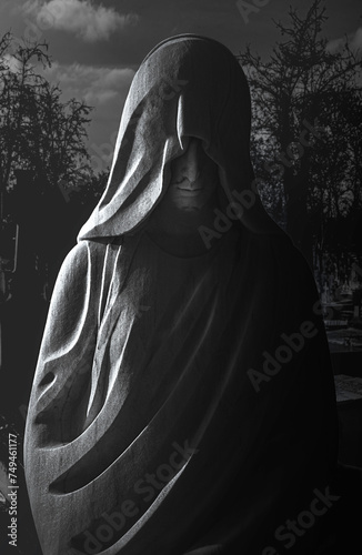 Mysterious sepulchral statue in the Almudena Cemetery, Madrid photo
