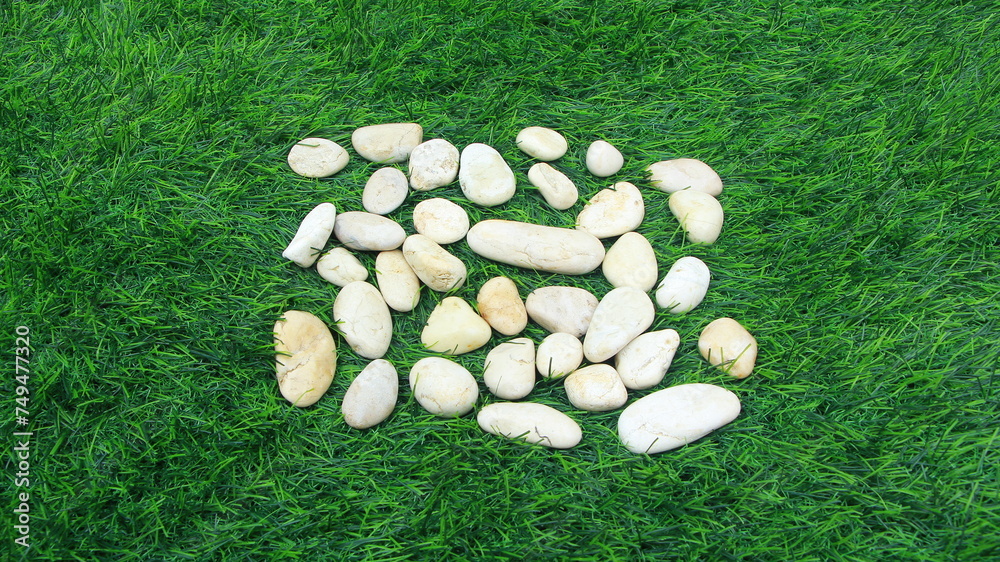 Naklejka premium Natural stone with texture, green grass, background