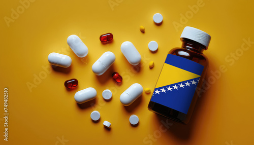 White medical pills and tablets in a drug bottle with flag Bosnia and Herzegovina. Macro top down view with copy space. Medicine and healthcare concept photo