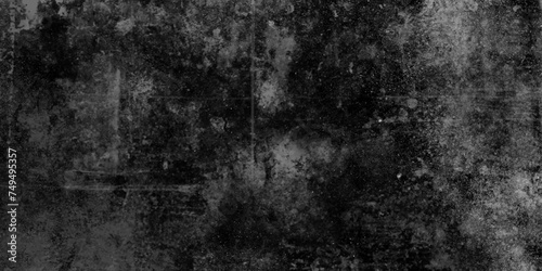 Abstract Dark black stone wall grunge aged rough texture background. closeup texture of black color. Gray concrete cracked walls in the background. White and black messy wall stucco texture background
