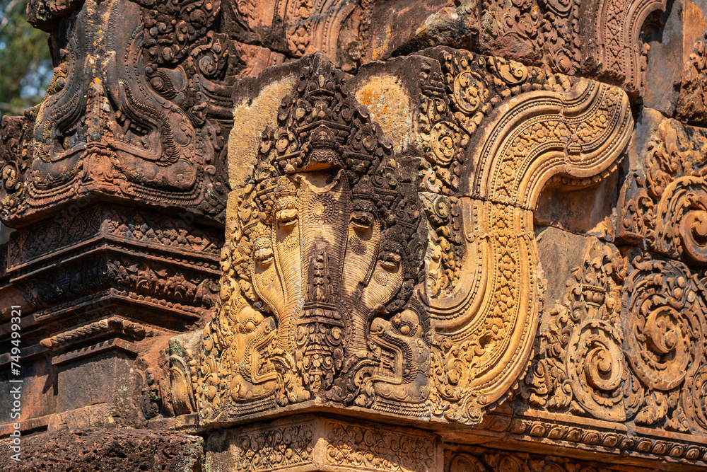 Bas-relief of Banteay Srei, the temple known for its beautiful carvings on red sandstone in Siem Reap, Cambodia.