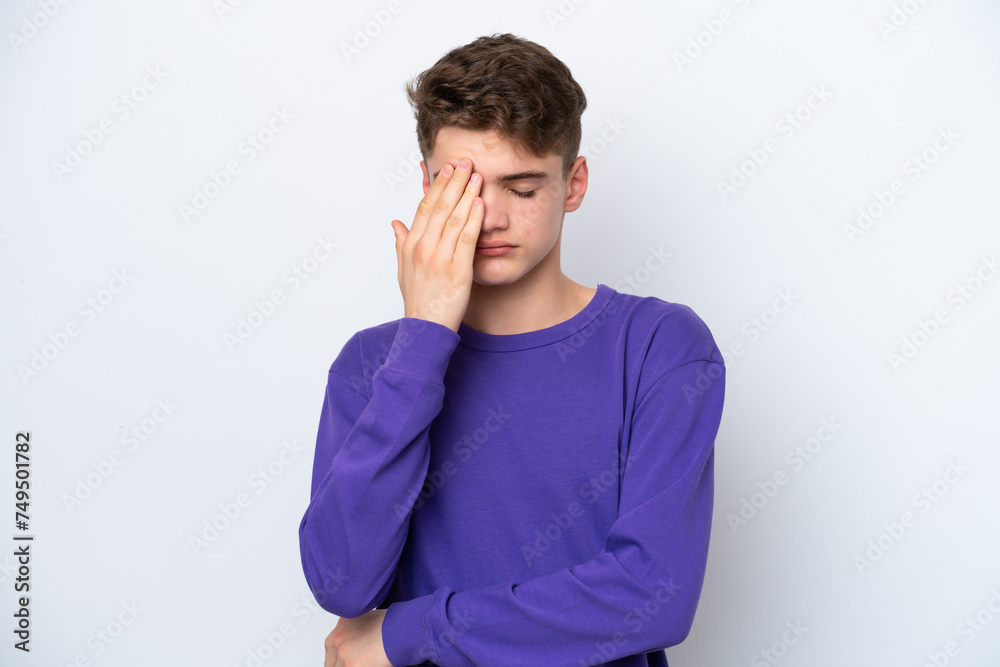 Teenager Russian man isolated on white background with headache