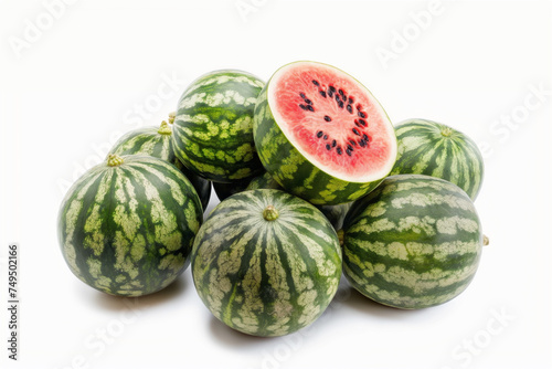 group of green watermelons with one cut open, revealing its bright red juicy inside with seeds, against a white background.