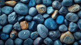 An abstract background of blue pebbles. Stone background with blue vintage color. A sea pebble beach with turquoise stones. Natural beauty.