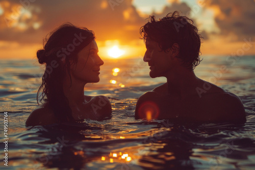 Caucasian young couple in love swim in tropical sea