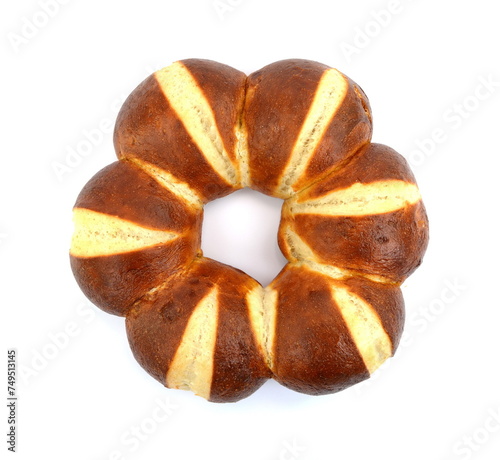 Freshly baked traditional German laugenbrot. Bavarian homemade pretzel rolls lye bread, close-up, isolated on white background. photo