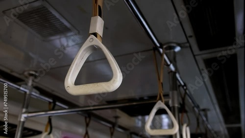 Wallpaper Mural Hanging strap handrails in metro car. Torontodigital.ca
