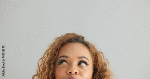 Woman, face and thinking with decision, choice or selection on a gray studio background. Closeup of female person, model or forehead in wonder or thought for choose, option or picking on mockup space