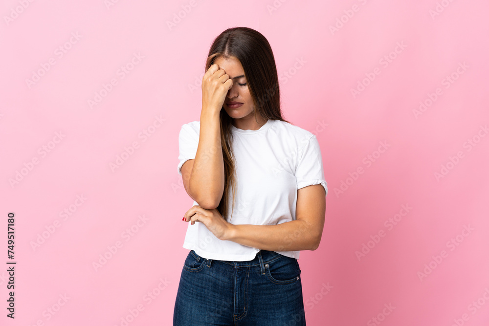 Young Uruguayan woman isolated on pink background with headache Young Uruguayan woman isolated on pink background with headache