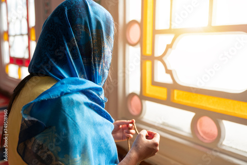 Photography Muslim woman prays rosary