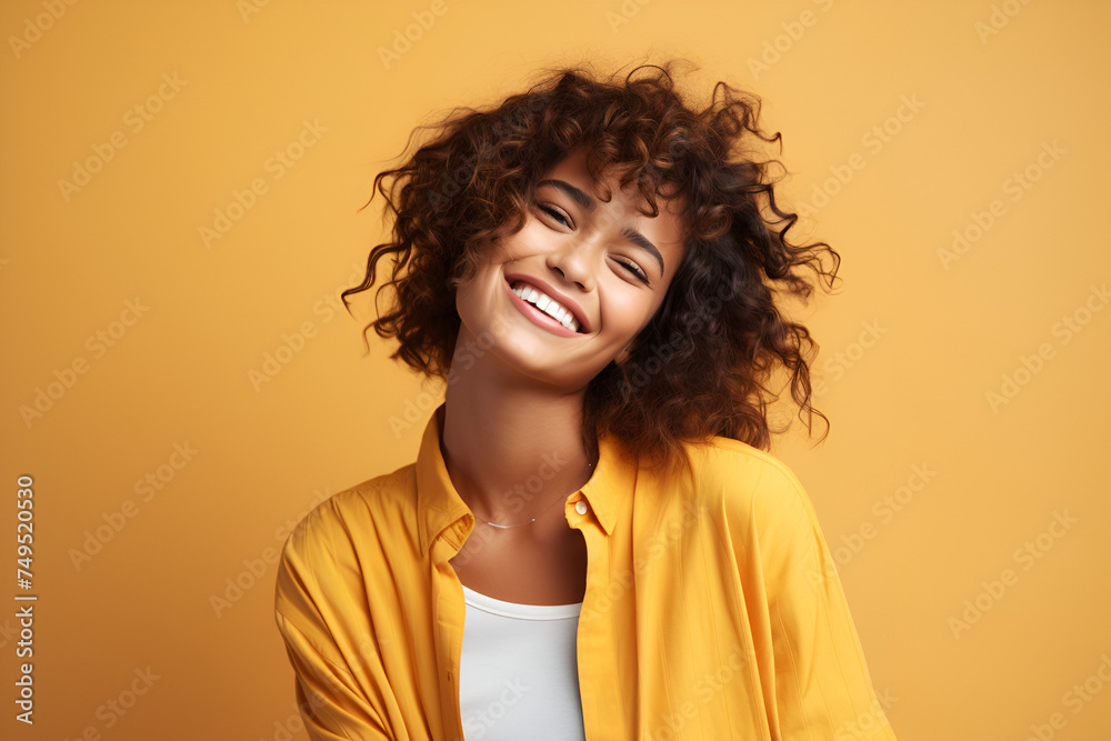 Smiling girl on yellow background Smiling girl on yellow background
