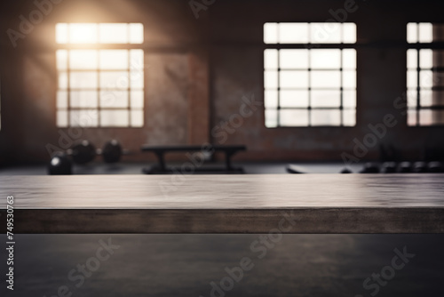 The empty concrete table top with a blurred background of a gym