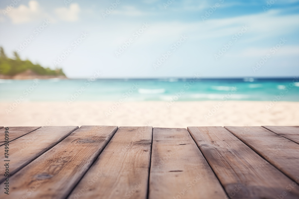 The empty wood table top with a blurred background of a sand beach The empty wood table top with a blurred background of a sand beach