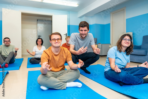 Yoga instructor directing a class with people with special needs