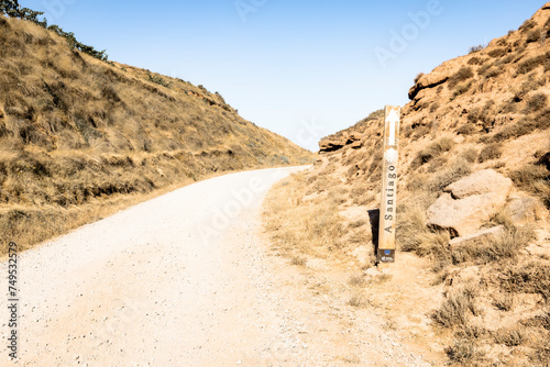 French Way of Saint James - way marker on a gravel road leaving Najera, La Rioja, Spain photo