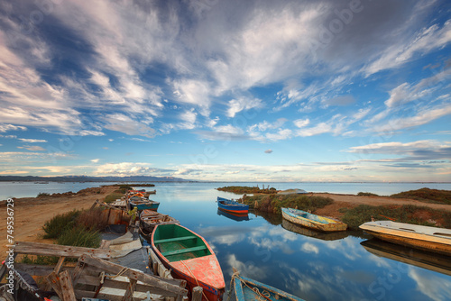 Fishing boats in a natural harbor in Fangar bay, Ebro Delta, Tarragona photo