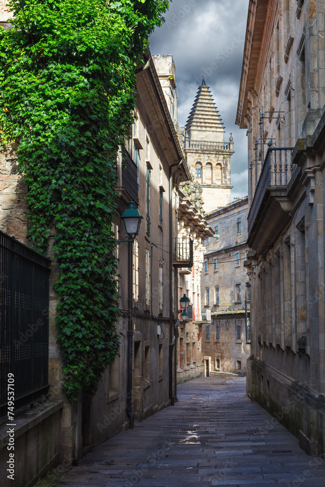 Pedestrian street and historic building facades in old town Santiago de Compostela, Spain.