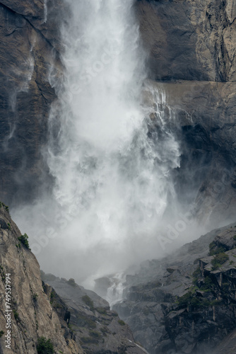 Billowing Mist Of Yosemite Falls Crashes Into The Surrounding Granite Cliffs