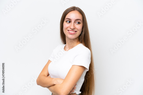 Young caucasian woman isolated on white background with arms crossed and happy