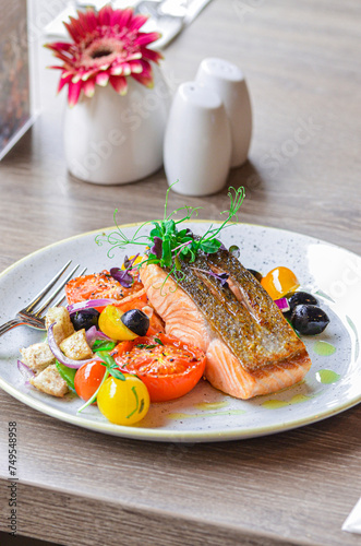 grilled fish salmon with vegetables, color food, healthy, tomatoe, olive, fresh food, serving , restaurant photo