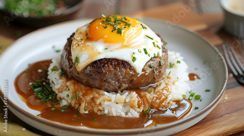 Savory loco moco hawaiian dish with egg on top photo