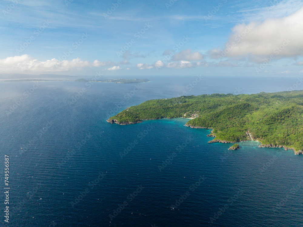 Seascape: Carabao Island and Boracay Island surrounded by blue sea. Philippines.