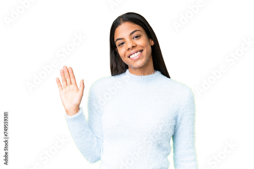 Young African American woman over isolated chroma key background saluting with hand with happy expression