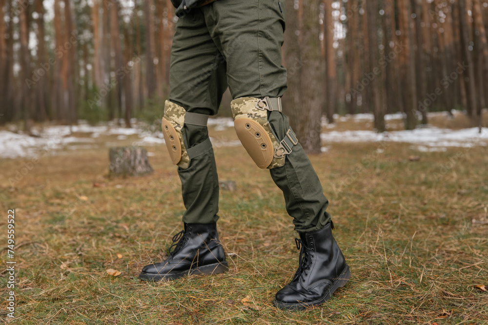 Tactical knee pads protect the legs of soldiers and warriors. Camouflage gear for convenience Tactical knee pads protect the legs of soldiers and warriors. Camouflage gear for convenience